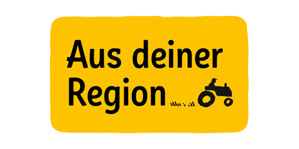 Der REWE Regional Hinweis mit dem Schriftzug „Regional“ und einem kleinen Traktor.